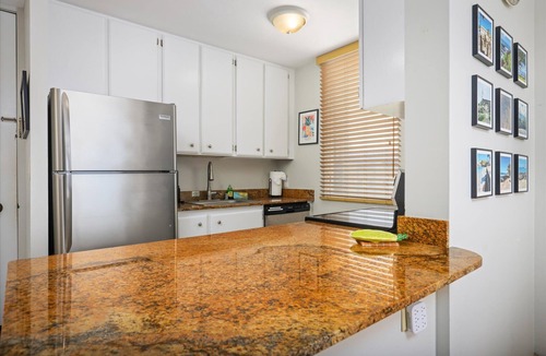 Historic Kailua Village Condo | Experience oceanfront luxury at Hale Kona Kai 301, a perfect getaway.