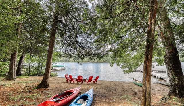 Inviting lakefront house with dock, sandy beach & screened porch in Adirondack